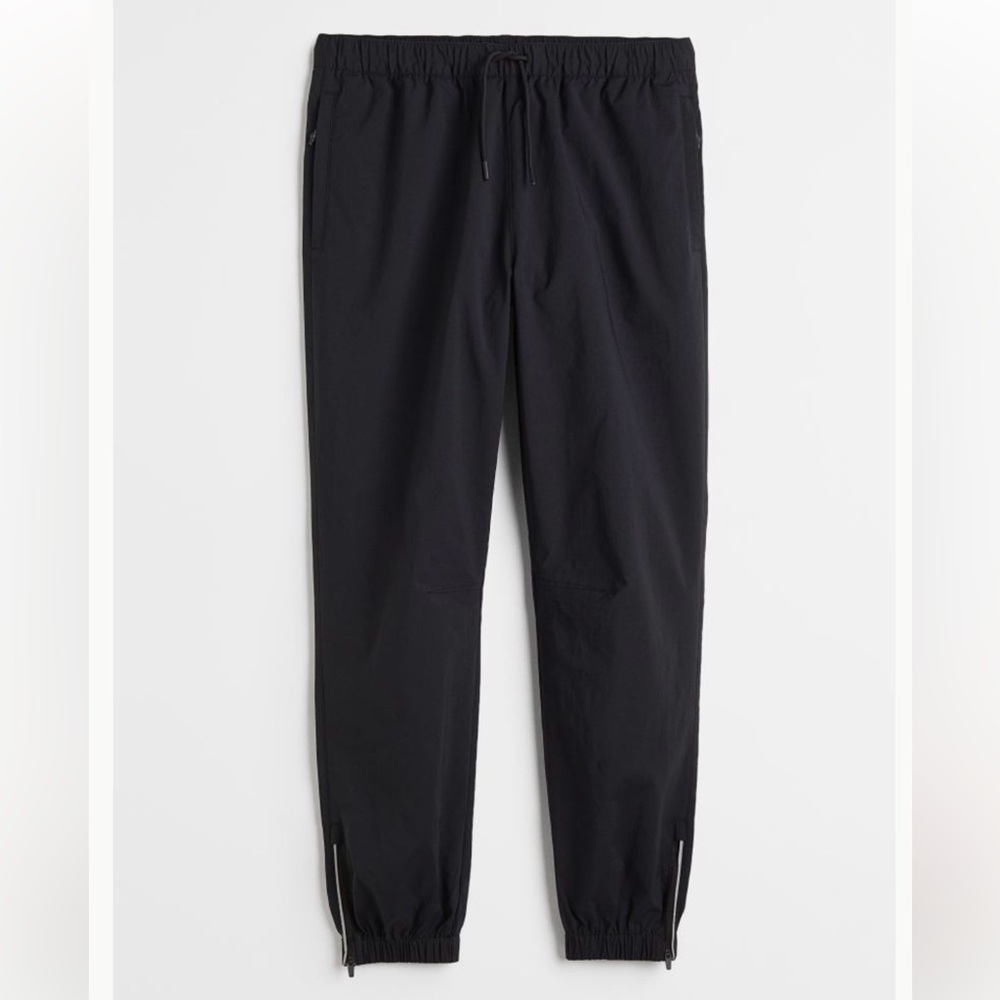 Divided Black Track Pants with Elastic Cuffs